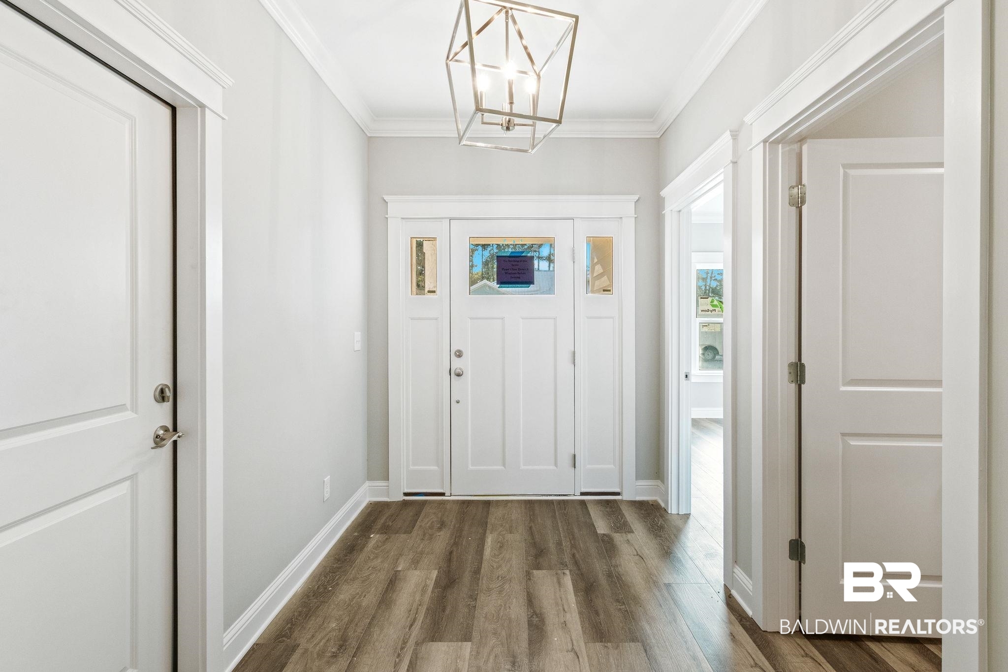 12441 Reunion Place Foley, AL 36535 - Photo 5 of 31 Interior space featuring a notable chandelier, crown molding, and wood-type flooring