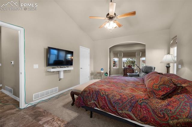 533 Talus Road Monument, CO 80132 - Photo 25 of 46 Bedroom with ceiling fan and vaulted ceiling