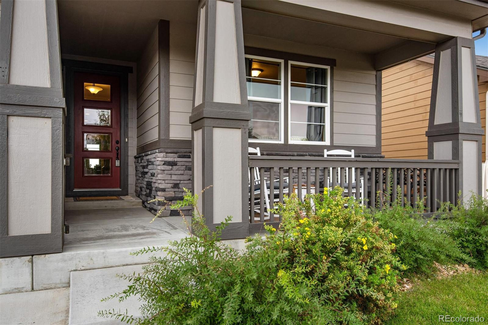 a view of a house with potted plants
