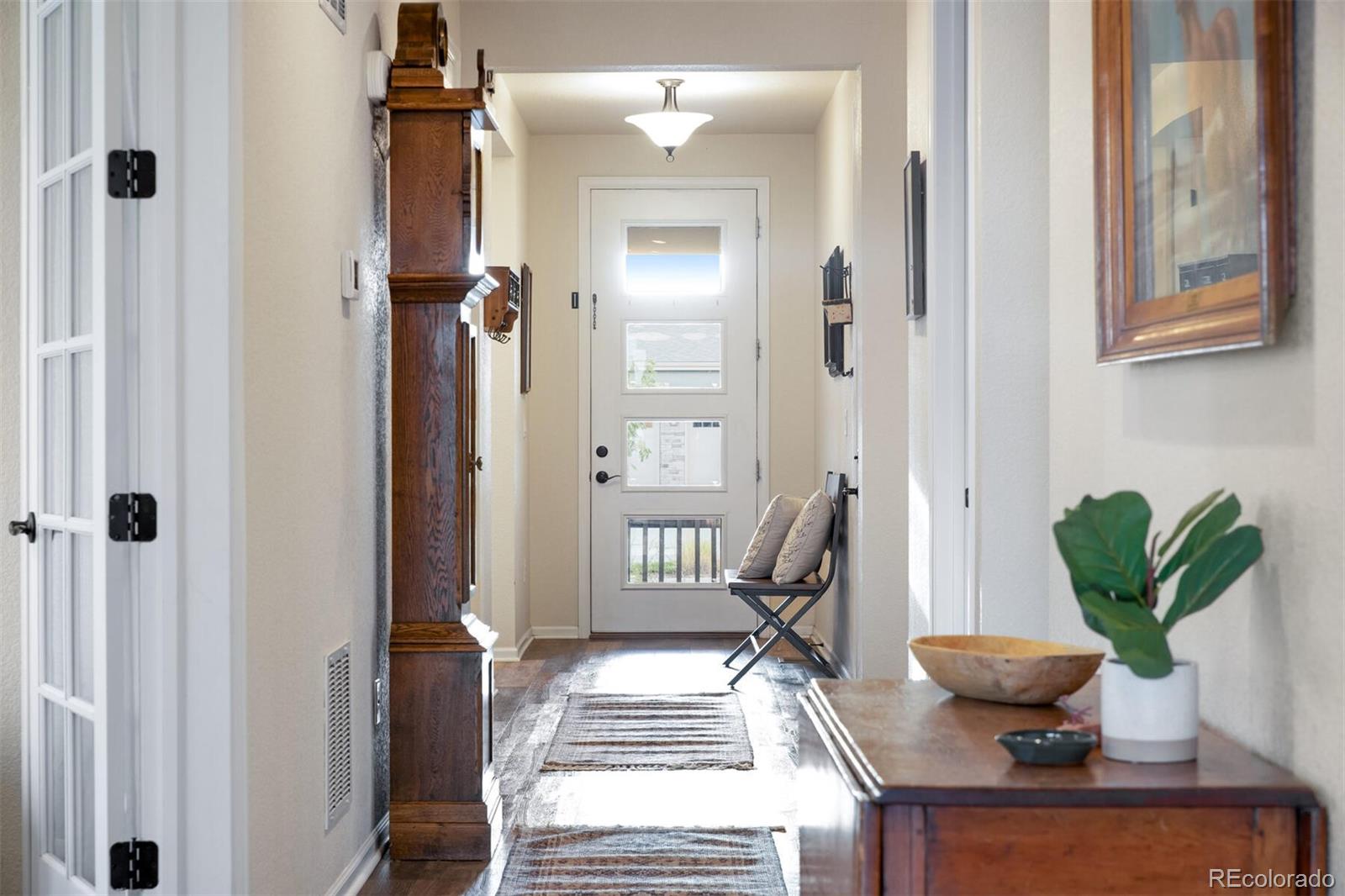 12646 Eagle River Road Firestone, CO 80504 - Photo 2 of 40 a living room with furniture and a potted plant