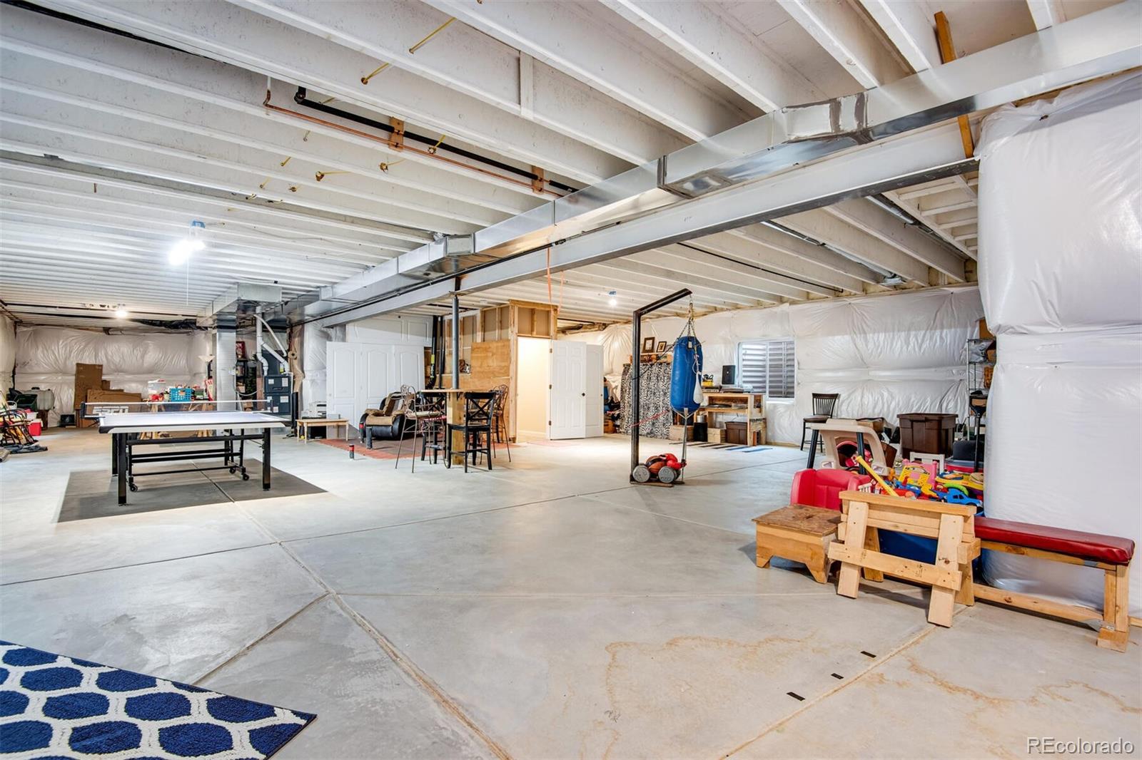 12646 Eagle River Road Firestone, CO 80504 - Photo 21 of 40 a view of a room with gym equipment