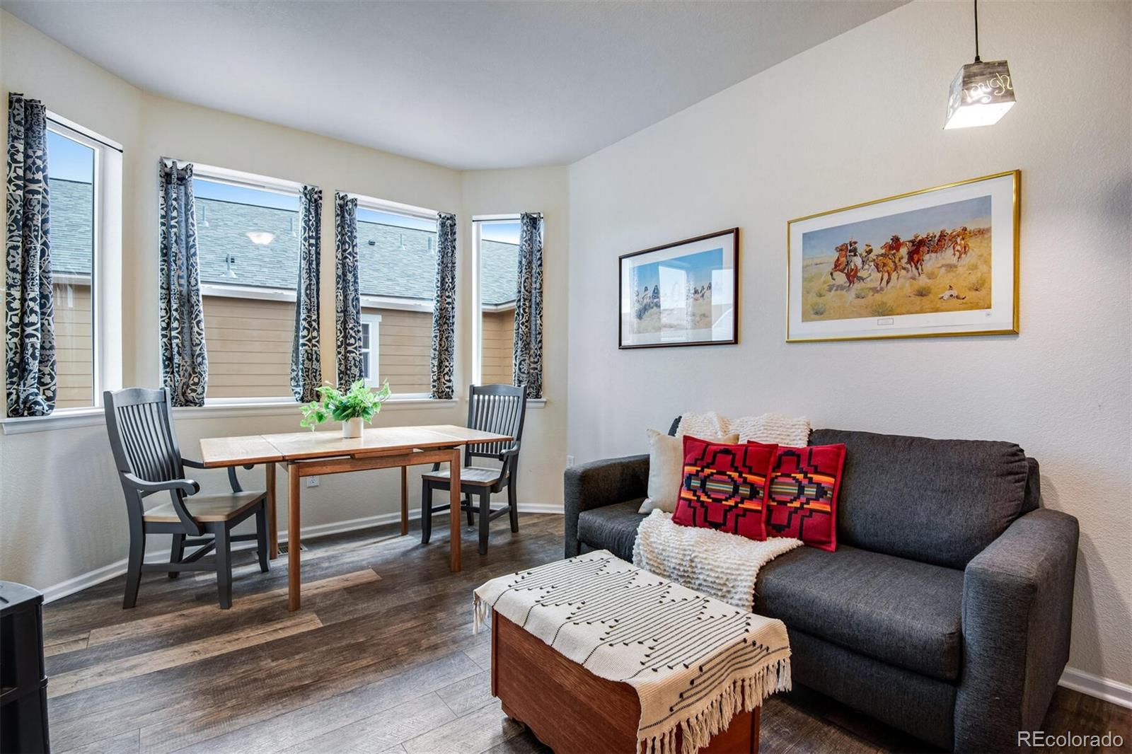 12646 Eagle River Road Firestone, CO 80504 - Photo 26 of 40 a living room with furniture a table and a large window