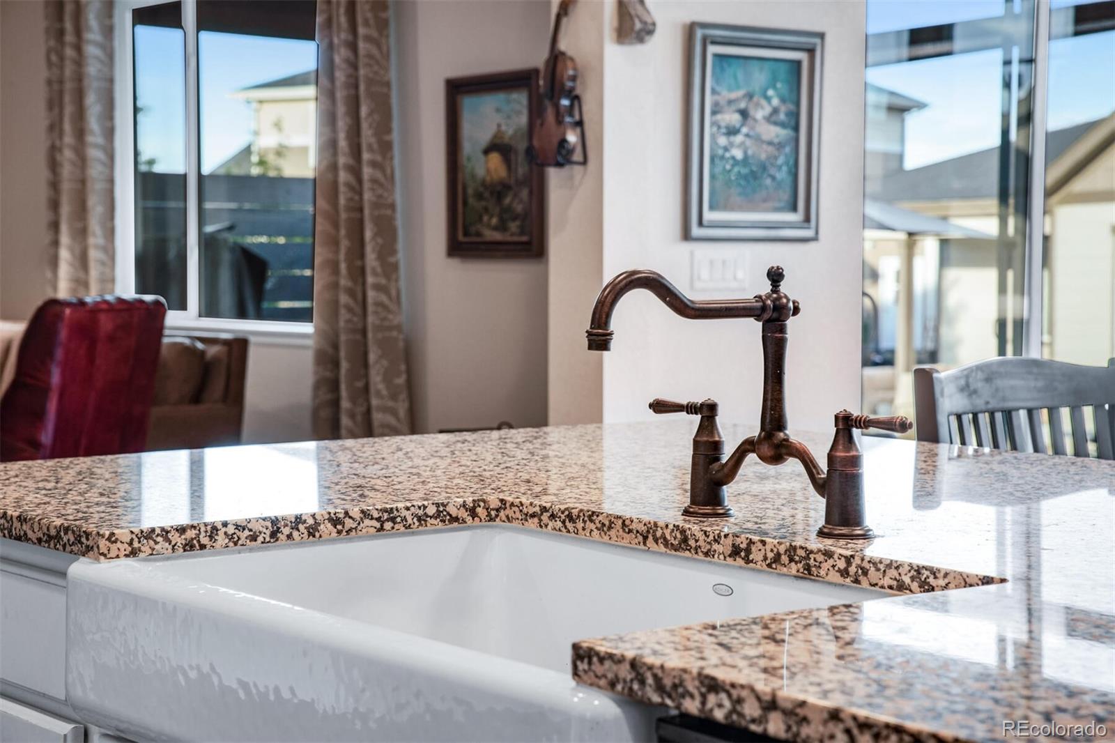 12646 Eagle River Road Firestone, CO 80504 - Photo 3 of 40 a bathroom with a granite countertop sink and a mirror