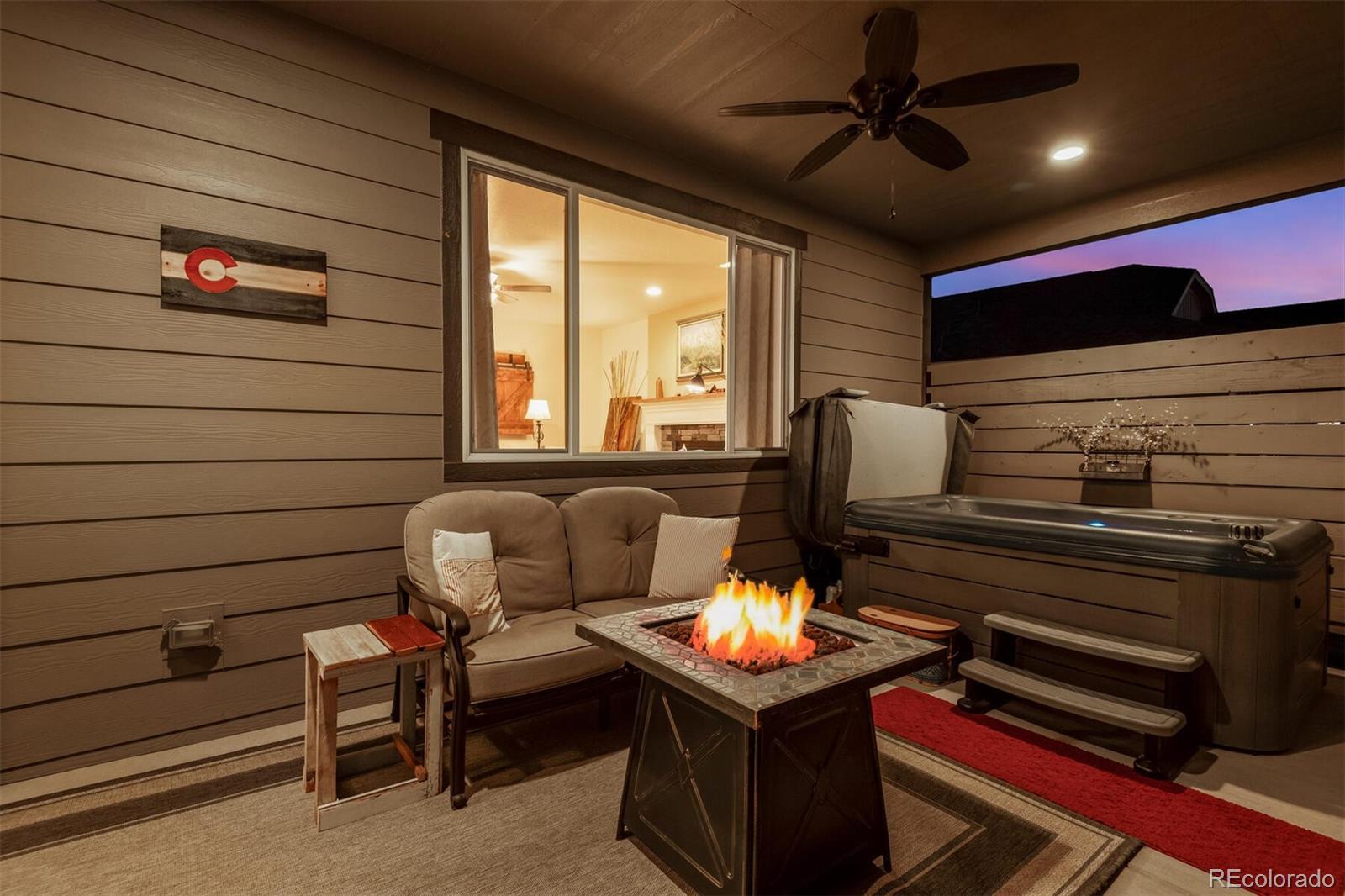 12646 Eagle River Road Firestone, CO 80504 - Photo 34 of 40 a living room with furniture and a flat screen tv