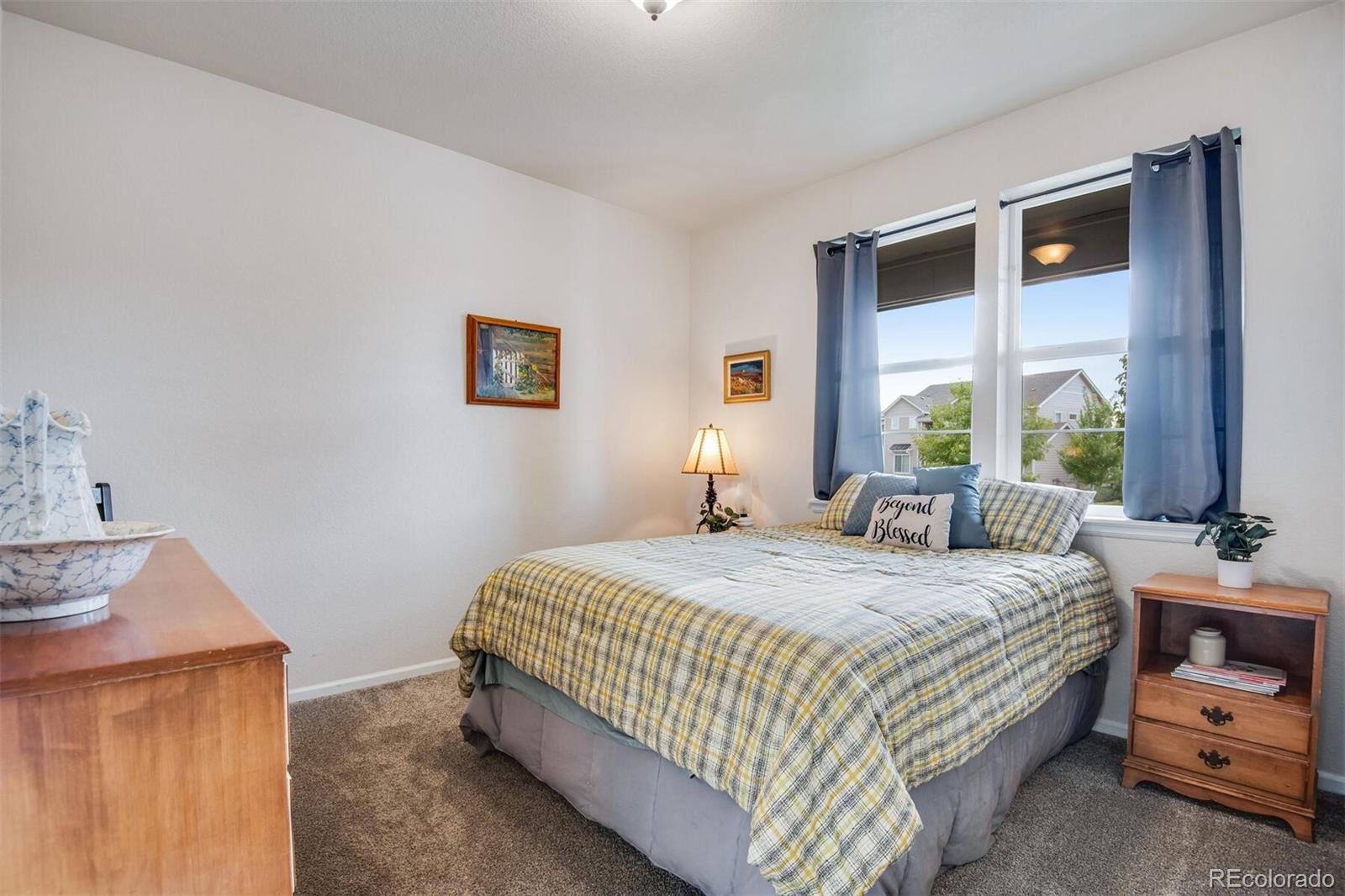 12646 Eagle River Road Firestone, CO 80504 - Photo 37 of 40 a bedroom with a bed and a window