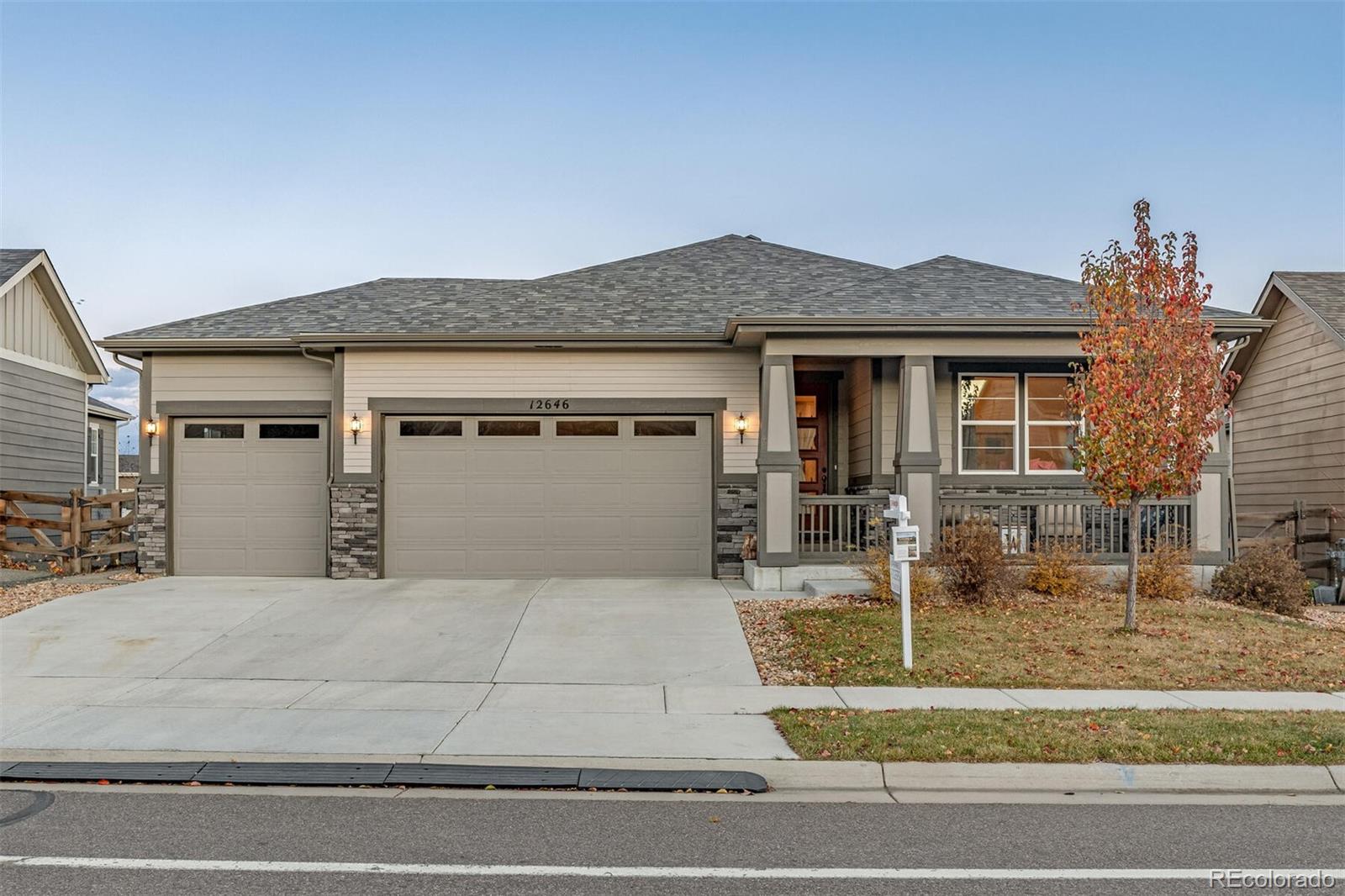 12646 Eagle River Road Firestone, CO 80504 - Photo 4 of 40 a front view of a house with garden