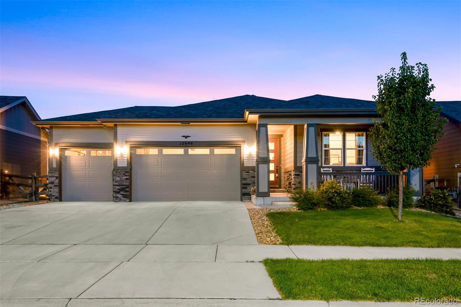 12646 Eagle River Road Firestone, CO 80504 - Photo 6 of 40 a view of a house with backyard and porch