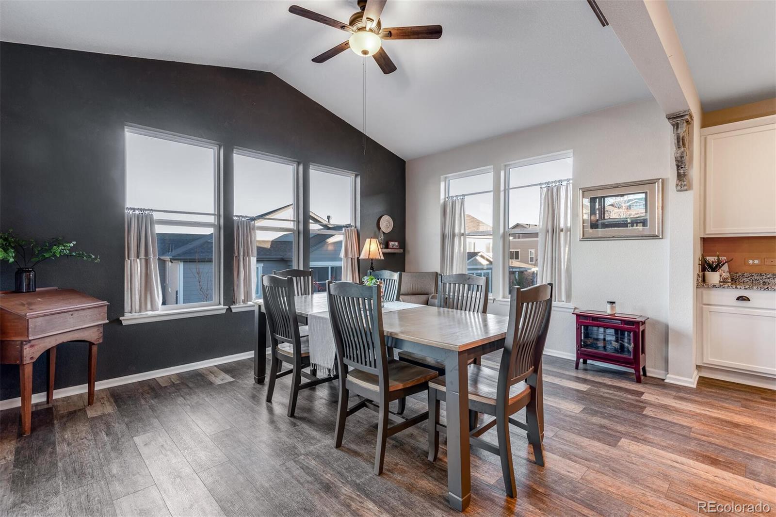 12646 Eagle River Road Firestone, CO 80504 - Photo 10 of 40 a view of a dining room with furniture window and wooden floor
