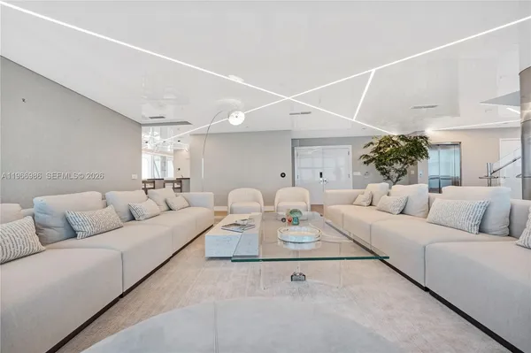 a kitchen with stainless steel appliances kitchen island granite countertop a stove and a microwave