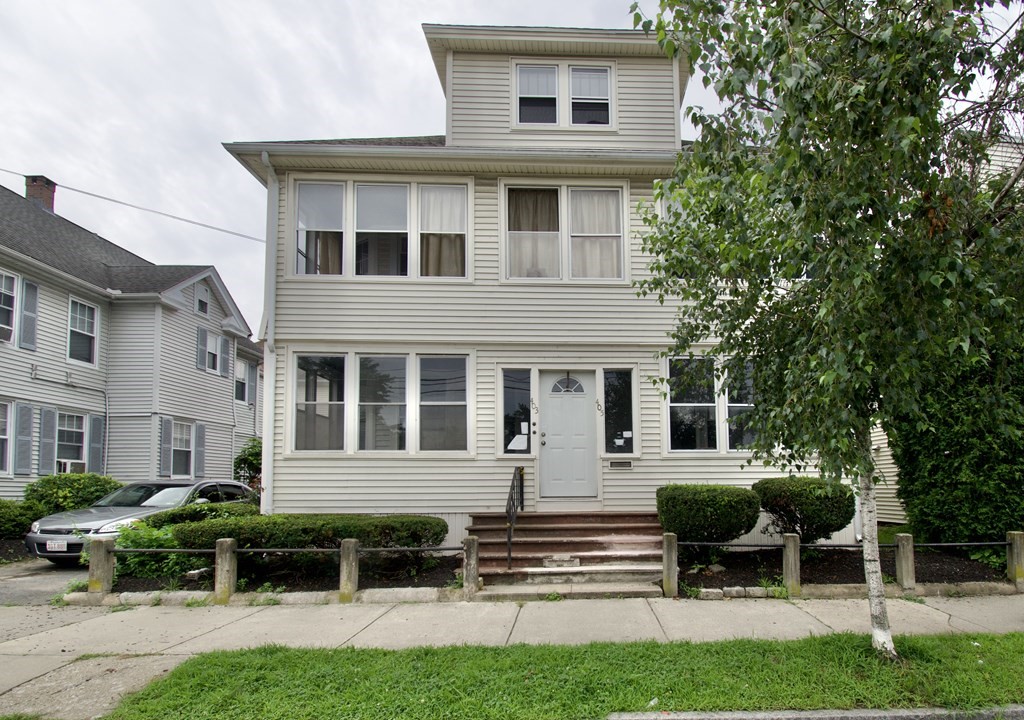 403-405 Main Street Springfield, MA 01151 - Photo 1 of 27 a front view of a house with a yard