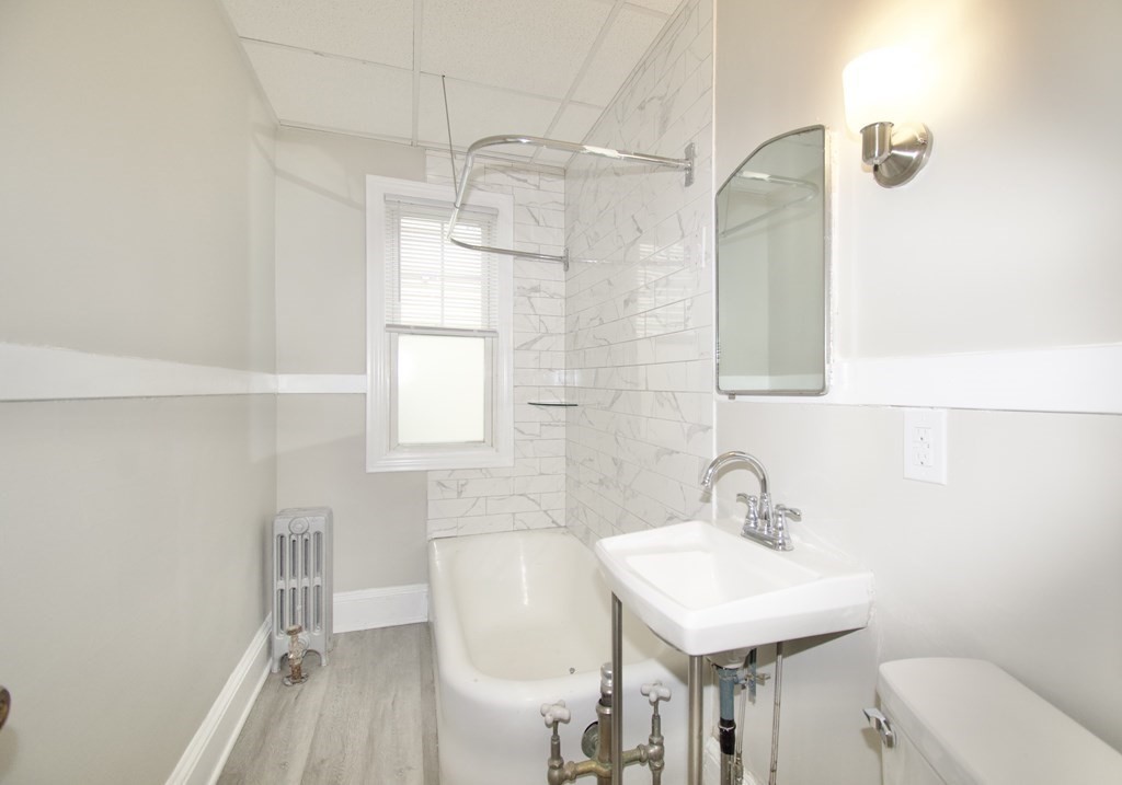 403-405 Main Street Springfield, MA 01151 - Photo 13 of 27 a bathroom with a sink a toilet and shower