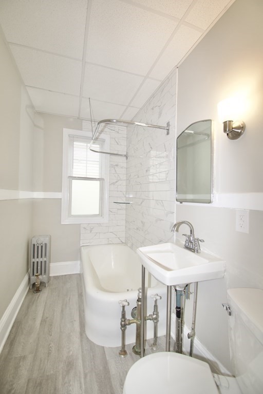 403-405 Main Street Springfield, MA 01151 - Photo 14 of 27 a bathroom with a sink and a mirror