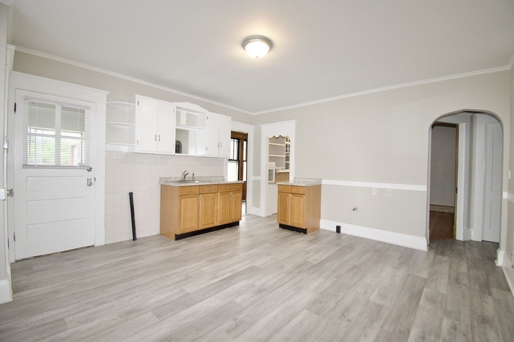 403-405 Main Street Springfield, MA 01151 - Photo 17 of 27 a kitchen with stainless steel appliances a refrigerator and a stove top oven