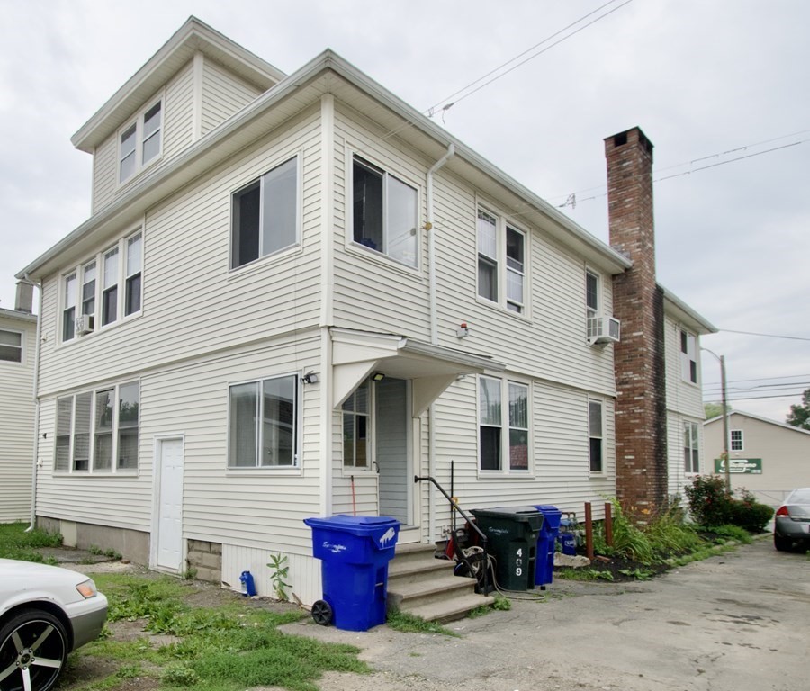 403-405 Main Street Springfield, MA 01151 - Photo 2 of 27 a front view of a house with patio