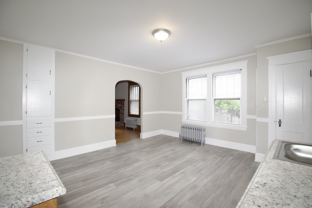 403-405 Main Street Springfield, MA 01151 - Photo 22 of 27 an empty room with wooden floor and windows