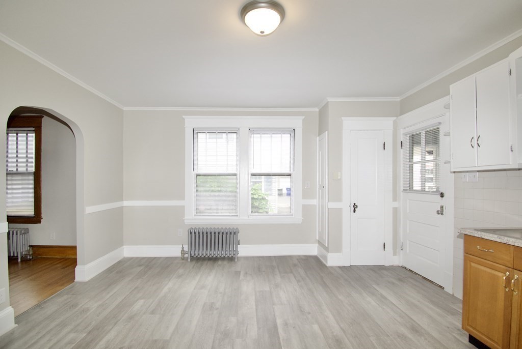403-405 Main Street Springfield, MA 01151 - Photo 24 of 27 a view of empty room with wooden floor and fan