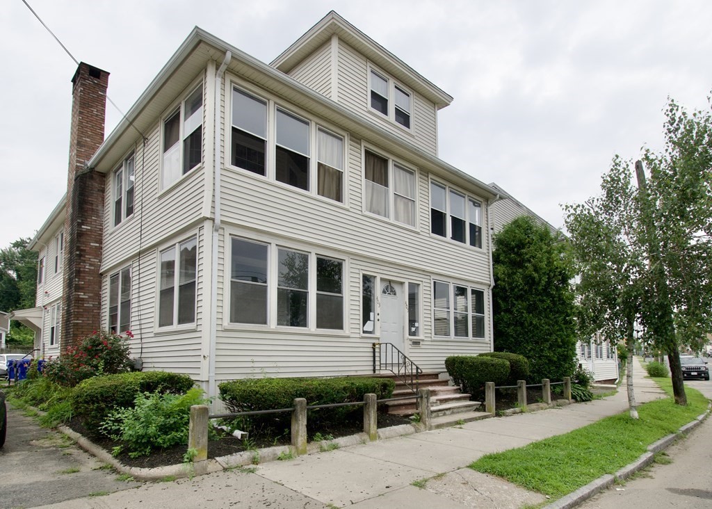 403-405 Main Street Springfield, MA 01151 - Photo 25 of 27 a front view of a house with a yard