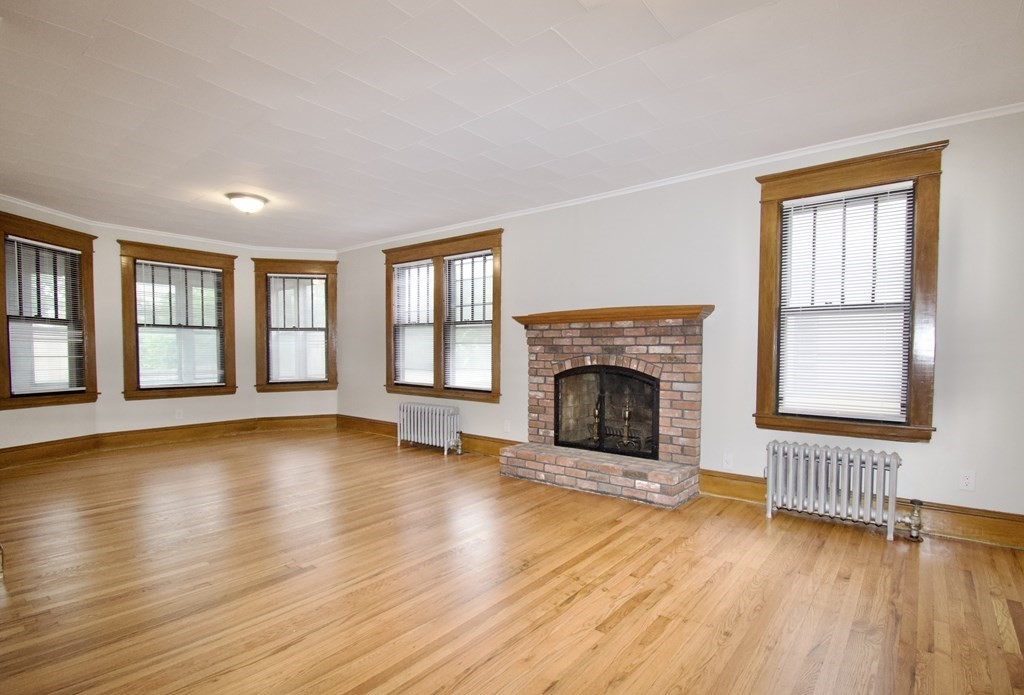 403-405 Main Street Springfield, MA 01151 - Photo 7 of 27 a view of an empty room with wooden floor and a window