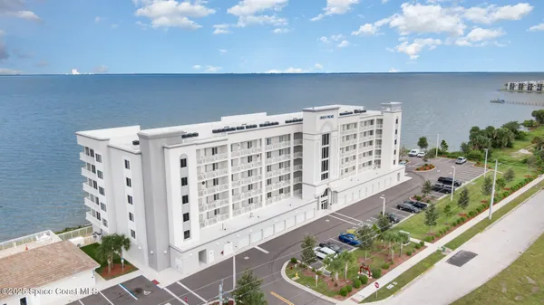 a view of a balcony with wooden floor