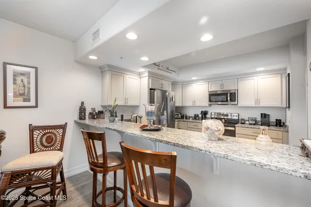 a kitchen with sink stove and cabinets