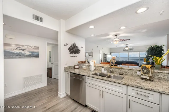 a kitchen with counter top space and sink