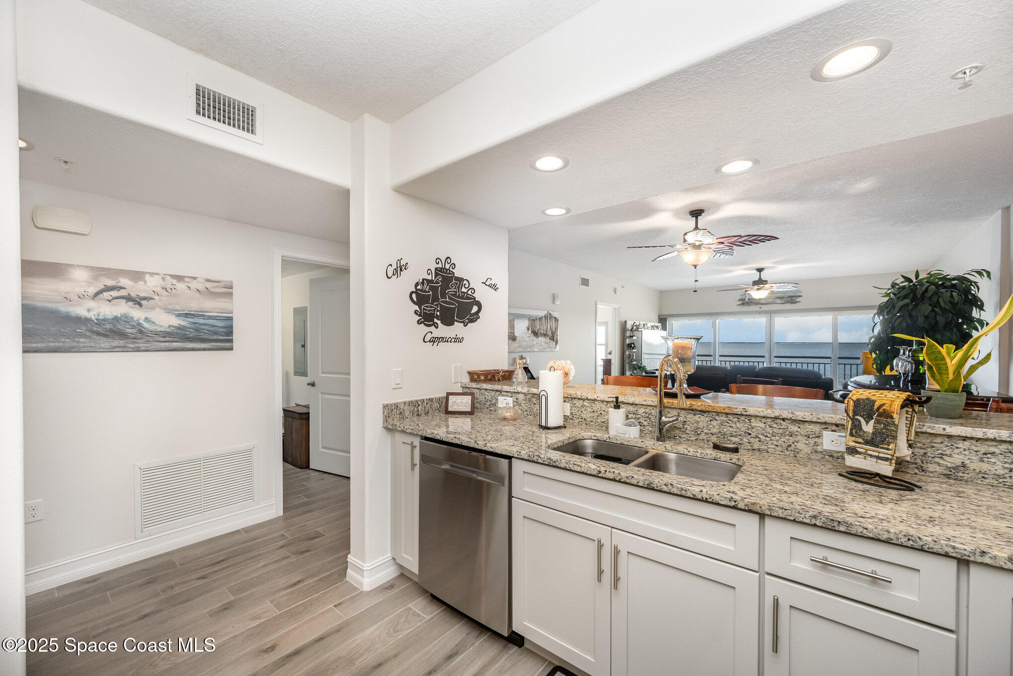 1825 Riverside Drive, Unit 202 Titusville, FL 32780 - Photo 17 of 31 a kitchen with counter top space and sink