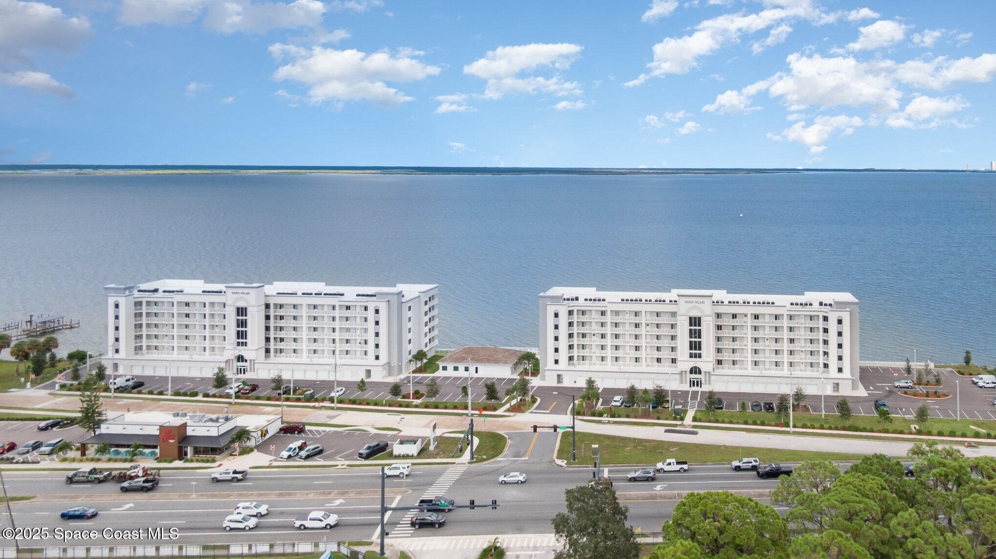 1825 Riverside Drive, Unit 202 Titusville, FL 32780 - Photo 2 of 31 a view of a city with tall buildings