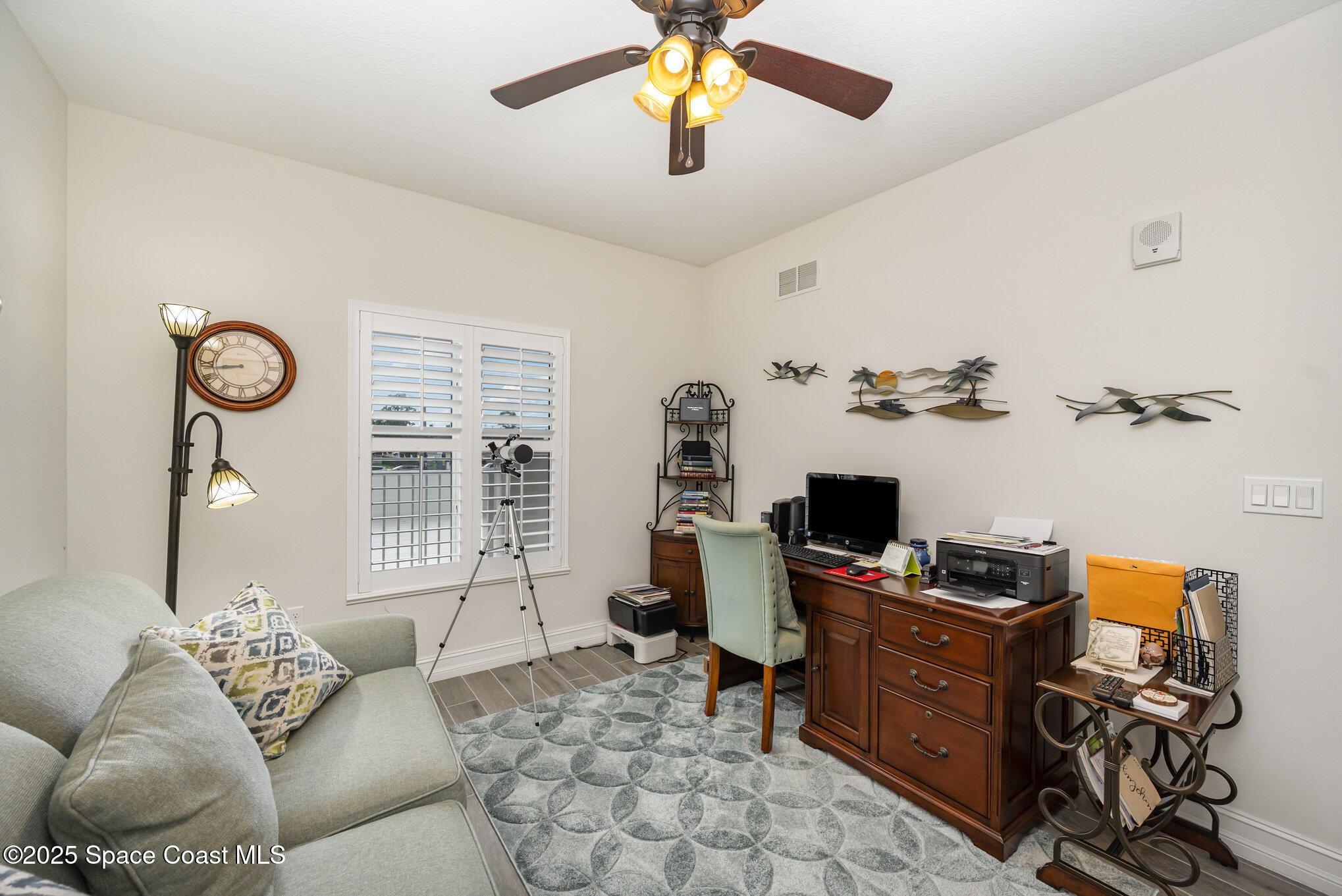 1825 Riverside Drive, Unit 202 Titusville, FL 32780 - Photo 27 of 31 a living room with furniture and a window