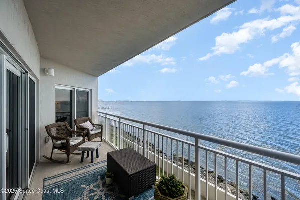 a view of balcony with furniture
