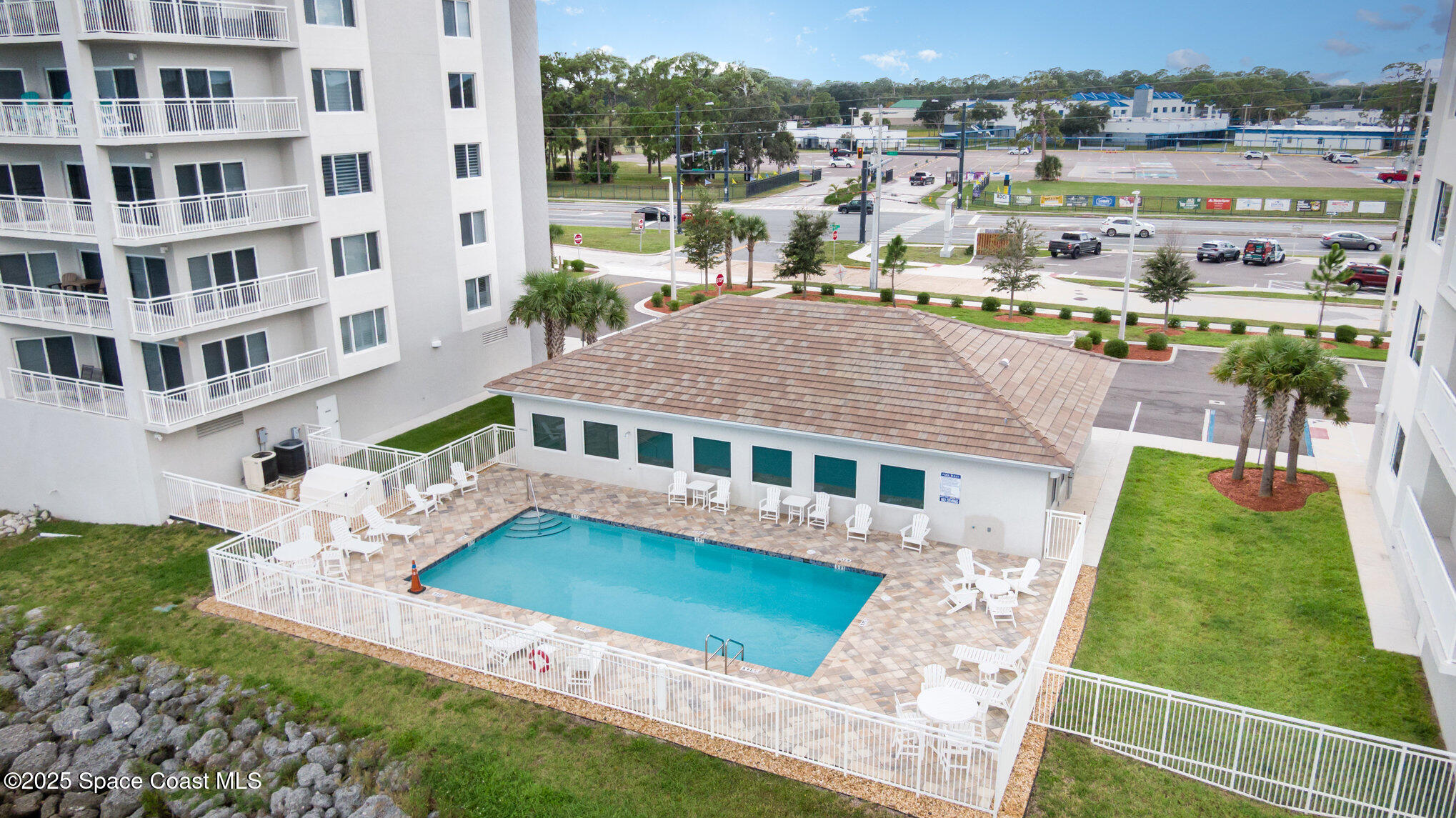 1825 Riverside Drive, Unit 202 Titusville, FL 32780 - Photo 3 of 31 a front view of a building with a yard