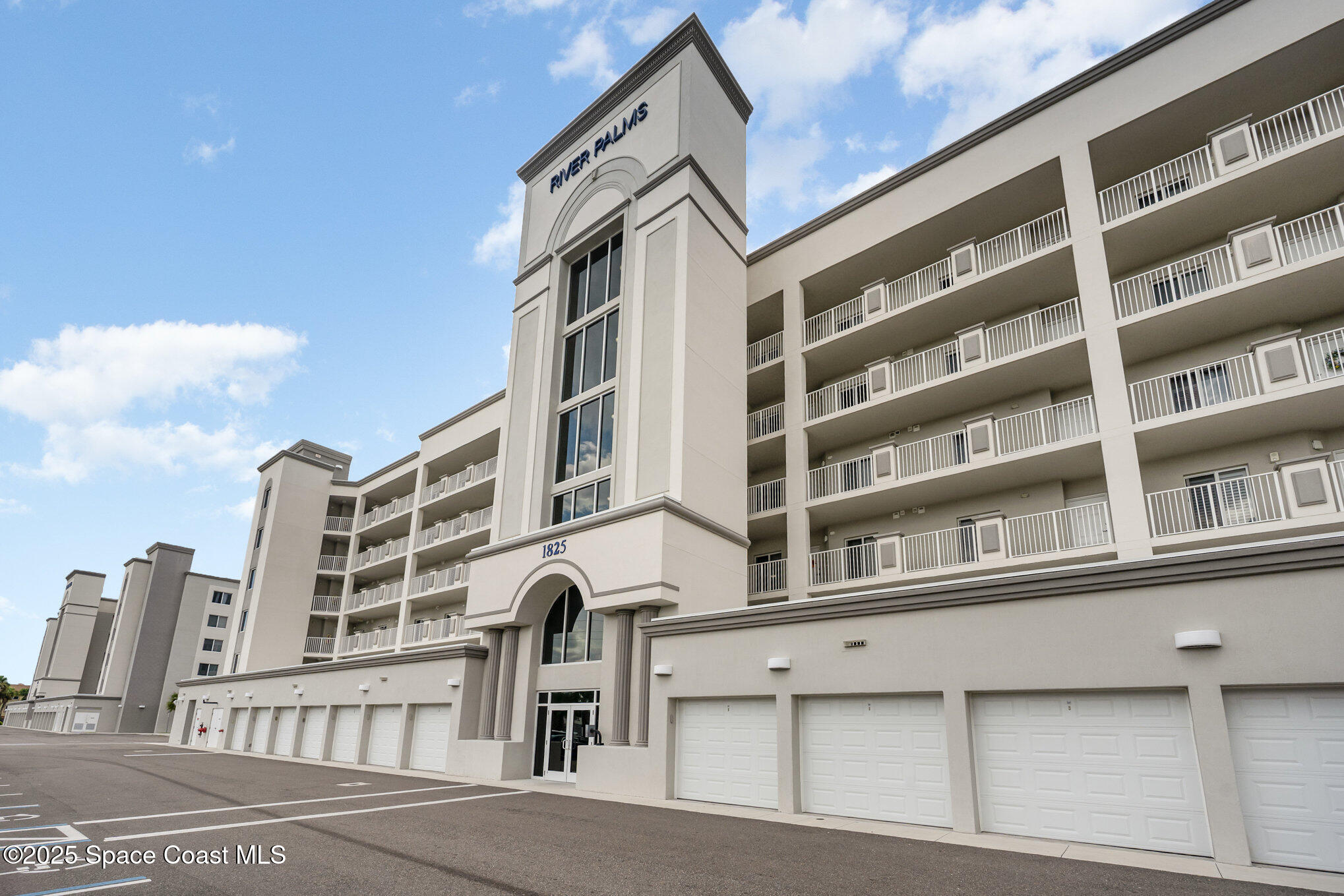 1825 Riverside Drive, Unit 202 Titusville, FL 32780 - Photo 5 of 31 a front view of a building with a street