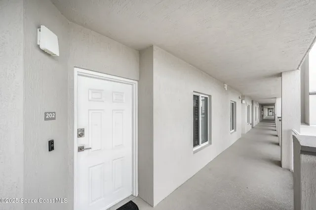 a view of hallway with livingroom