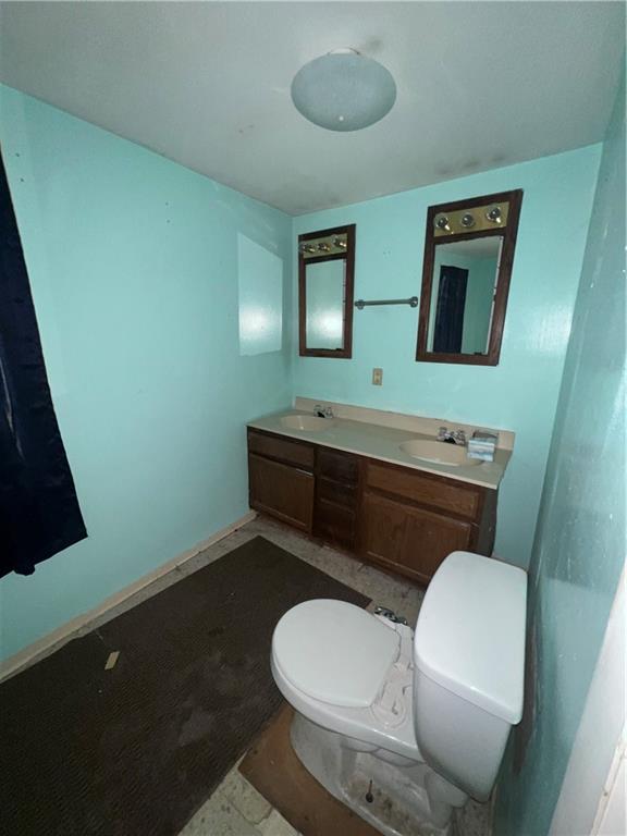 183 Country Club Road Washington, PA 15301 - Photo 8 of 18 a bathroom with a toilet a sink and mirror