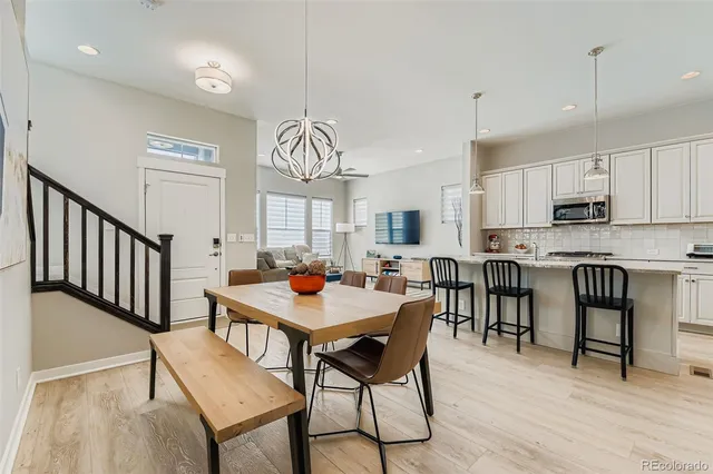 a view of a dining room with furniture window and wooden floor