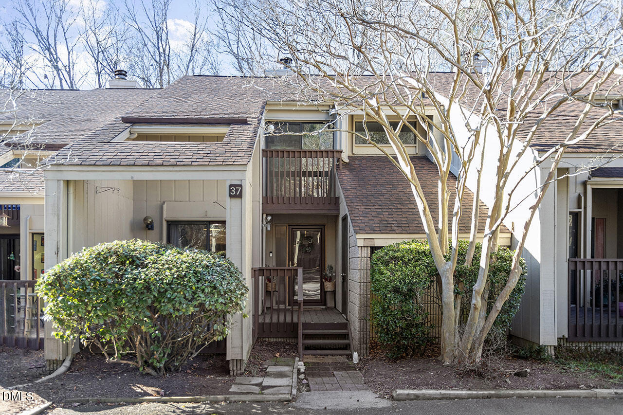 4100 Five Oaks Drive, Unit 37 Durham, NC 27707 - Photo 1 of 18 a front view of a house with garden