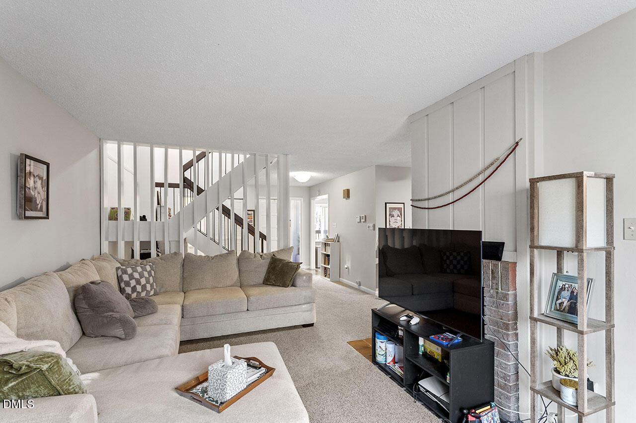 4100 Five Oaks Drive, Unit 37 Durham, NC 27707 - Photo 10 of 18 a living room with furniture and a flat screen tv