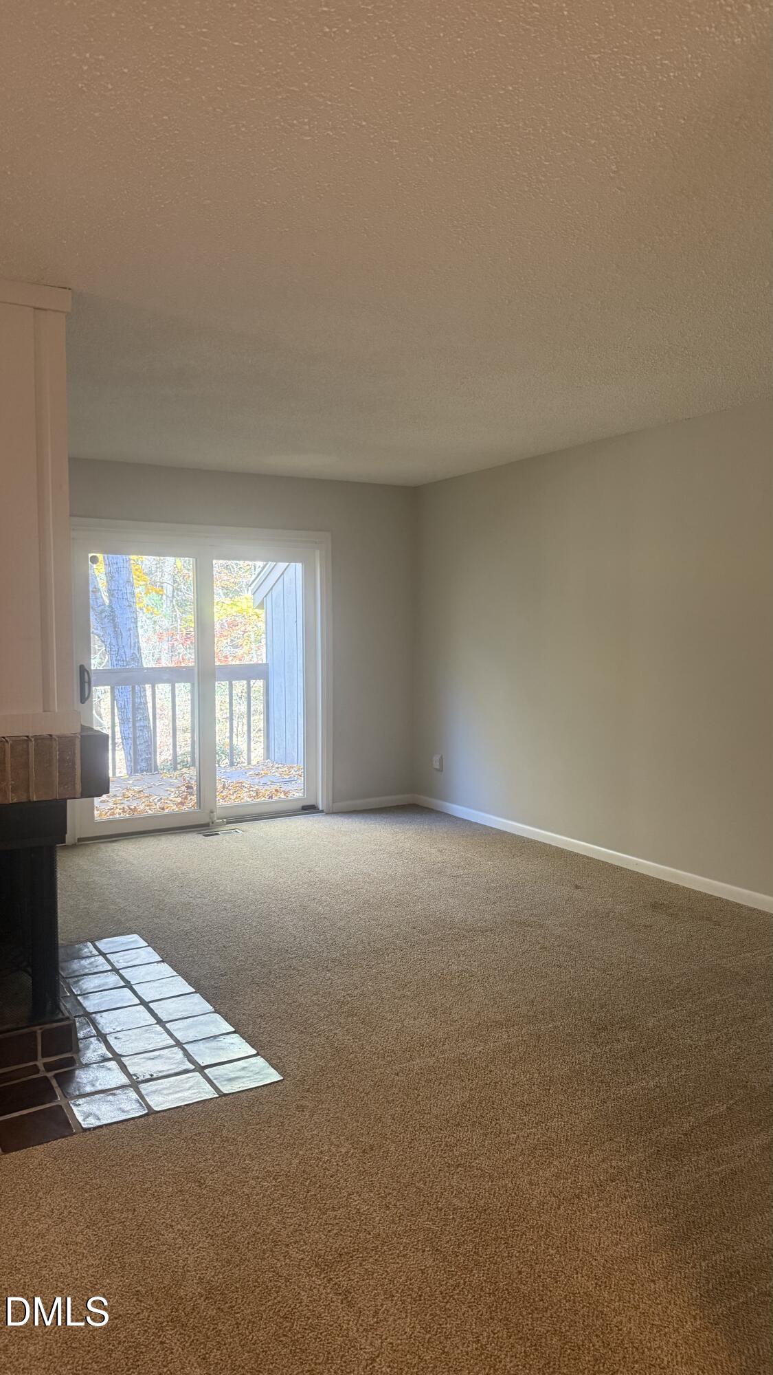 4100 Five Oaks Drive, Unit 37 Durham, NC 27707 - Photo 11 of 18 a view of an empty room with a window