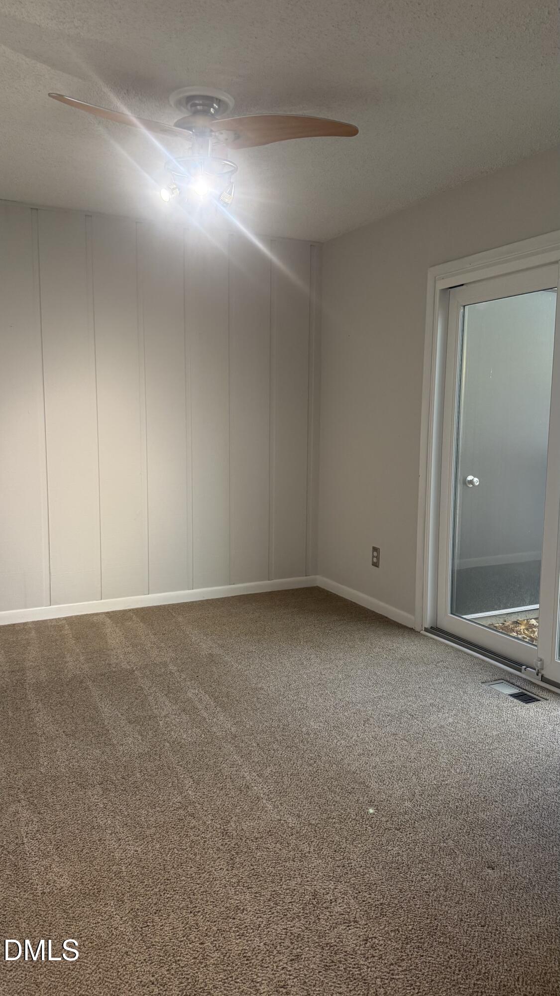 4100 Five Oaks Drive, Unit 37 Durham, NC 27707 - Photo 12 of 18 a view of an empty room and chandelier fan