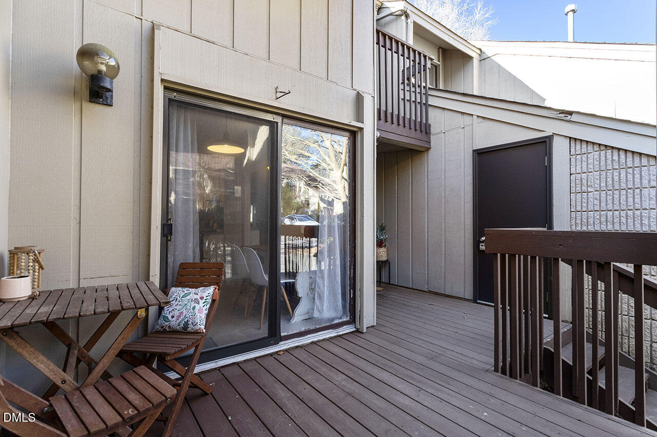 4100 Five Oaks Drive, Unit 37 Durham, NC 27707 - Photo 2 of 18 a view of a balcony with furniture and wooden floor