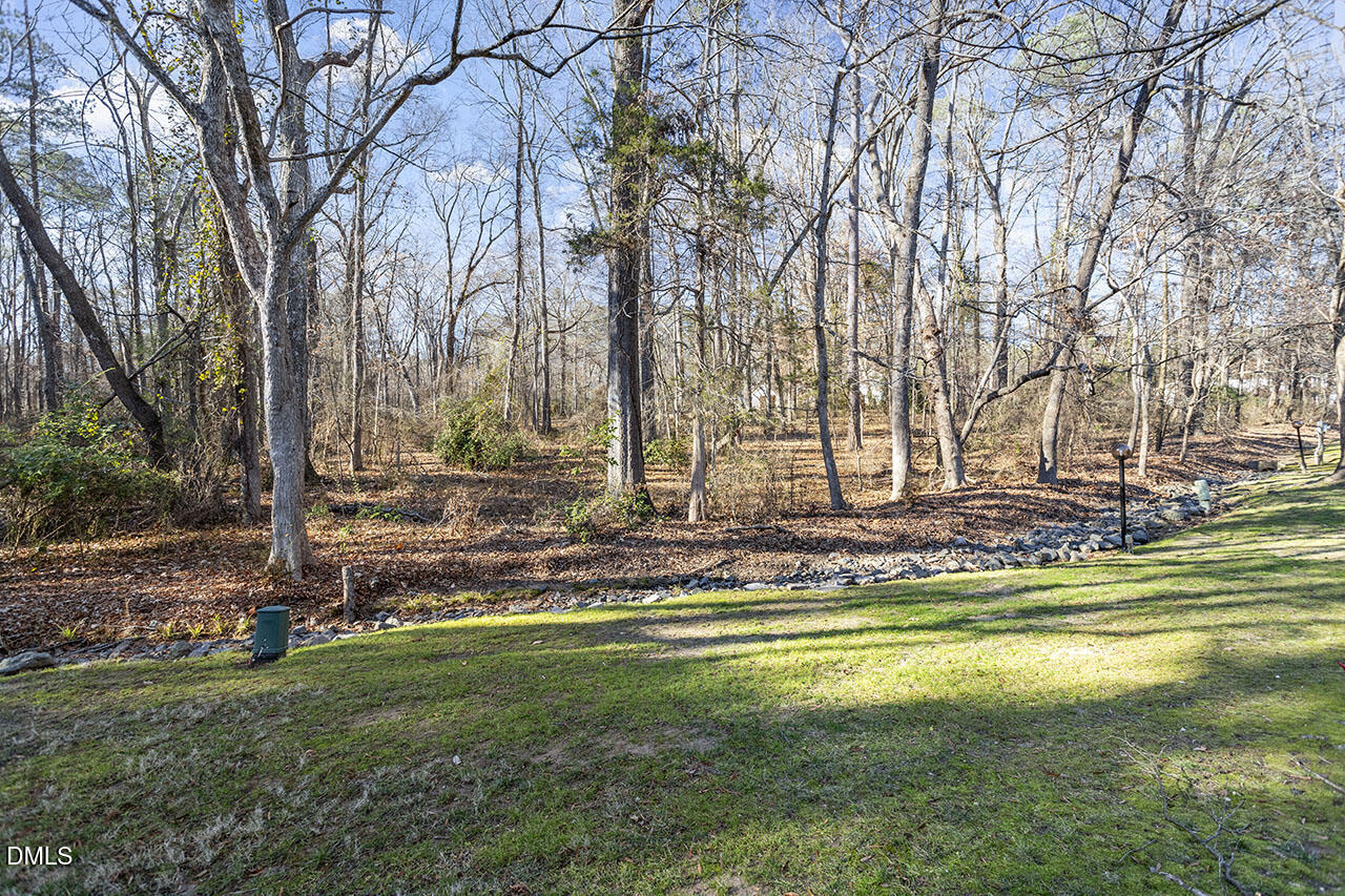 4100 Five Oaks Drive, Unit 37 Durham, NC 27707 - Photo 3 of 18 a view of outdoor space with garden
