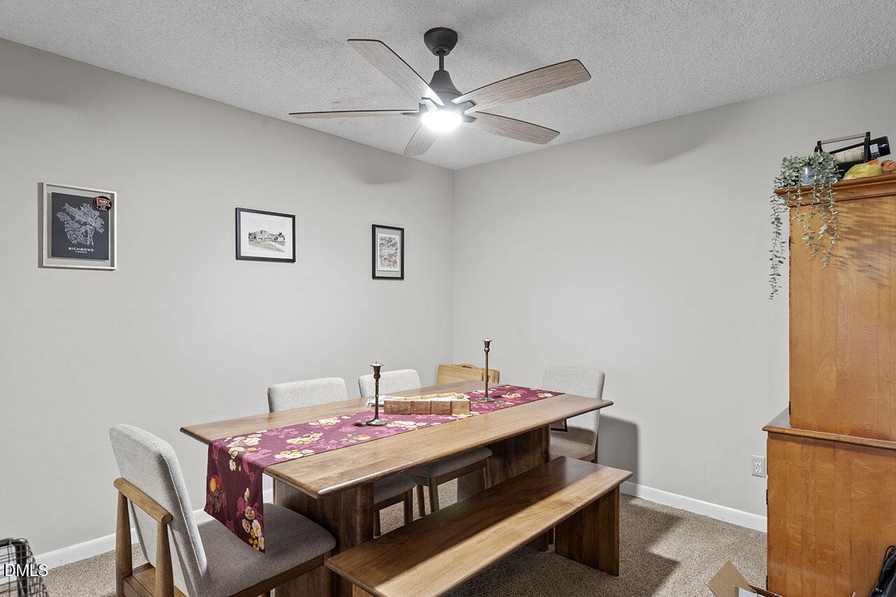 4100 Five Oaks Drive, Unit 37 Durham, NC 27707 - Photo 9 of 18 a room with a table chairs and a table