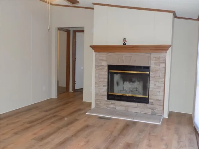 a kitchen with kitchen island granite countertop a sink cabinets and stainless steel appliances