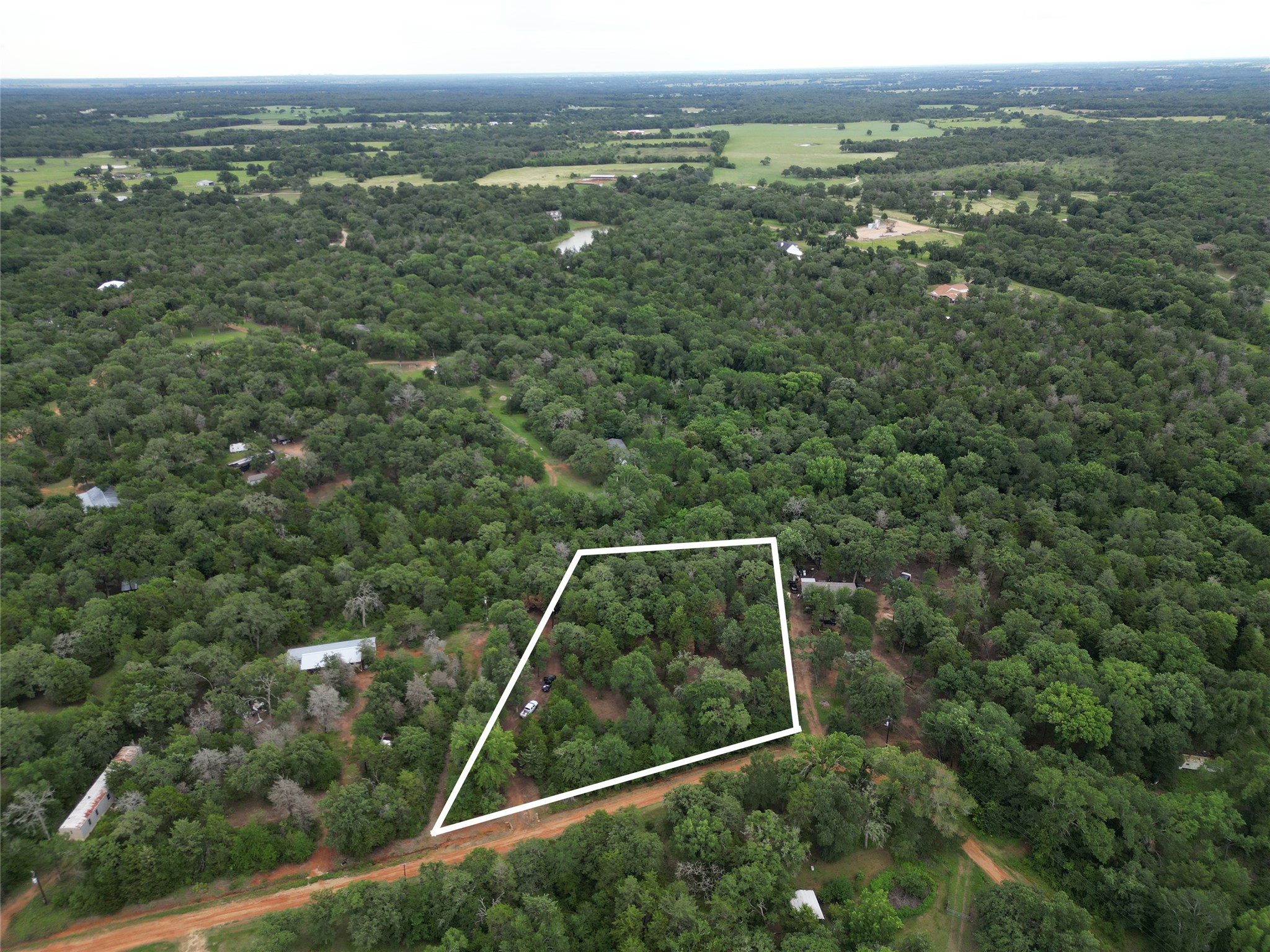 891 Cedar Creek Road Caldwell, TX 77836 - Photo 2 of 18 a view of a yard from a balcony