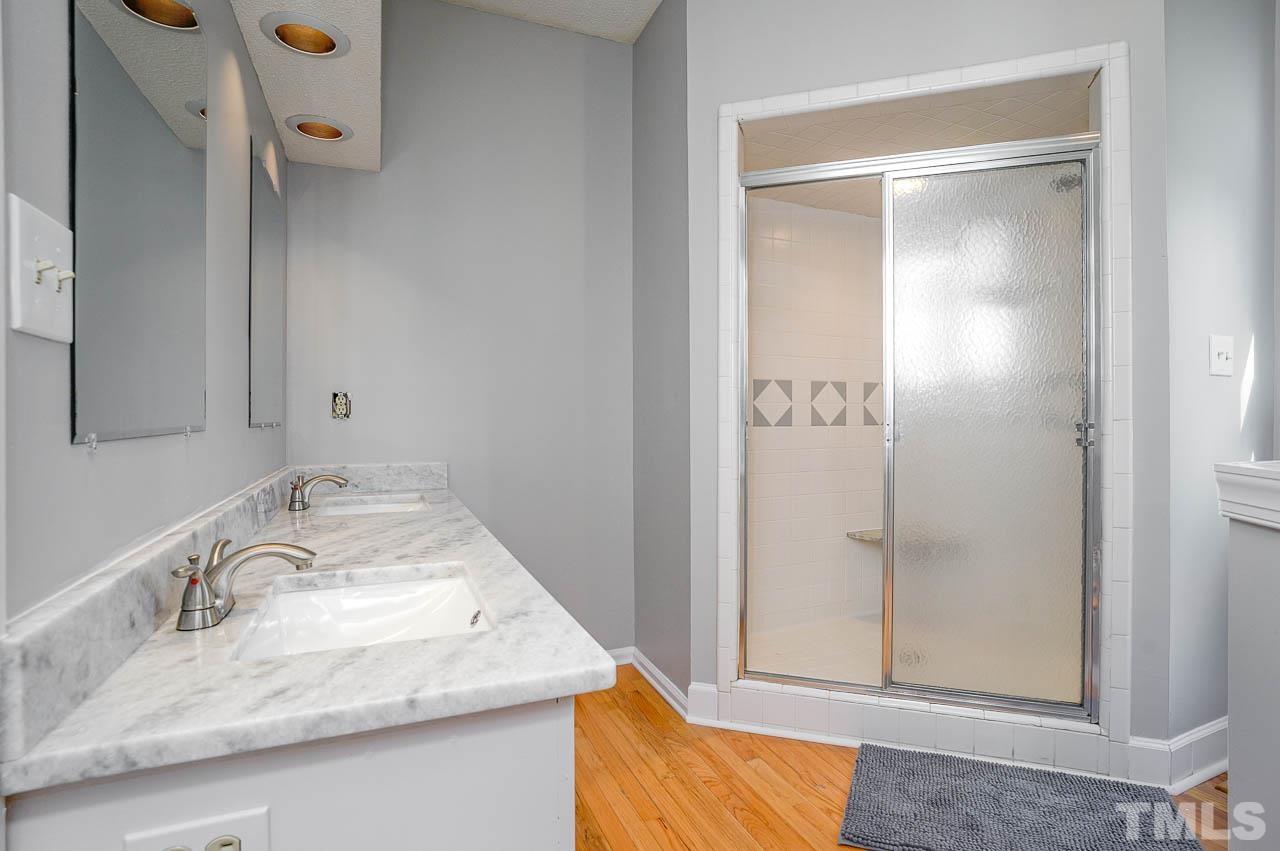8904 Cub Trail Raleigh, NC 27615 - Photo 8 of 12 Master Bath with Double Vanity & Walk-In Shower