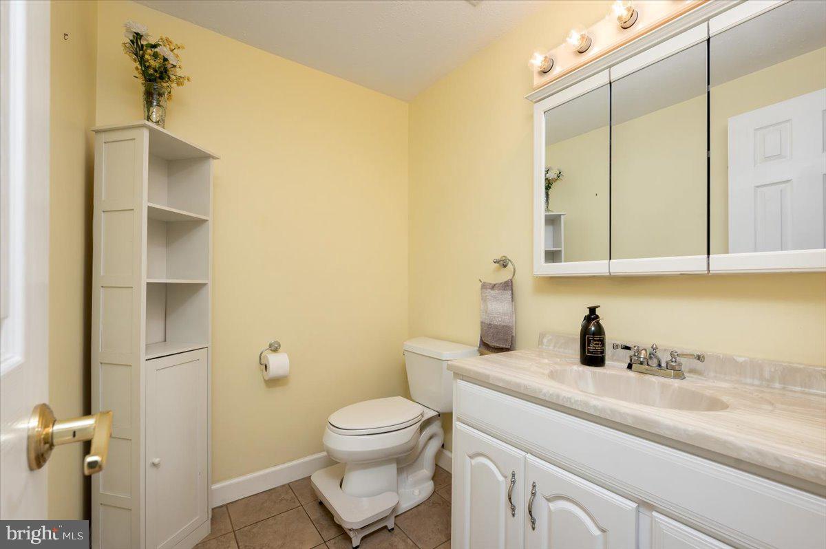 6343 Meadowland Drive Dunkirk, MD 20754 - Photo 24 of 31 a bathroom with a sink a toilet and shower