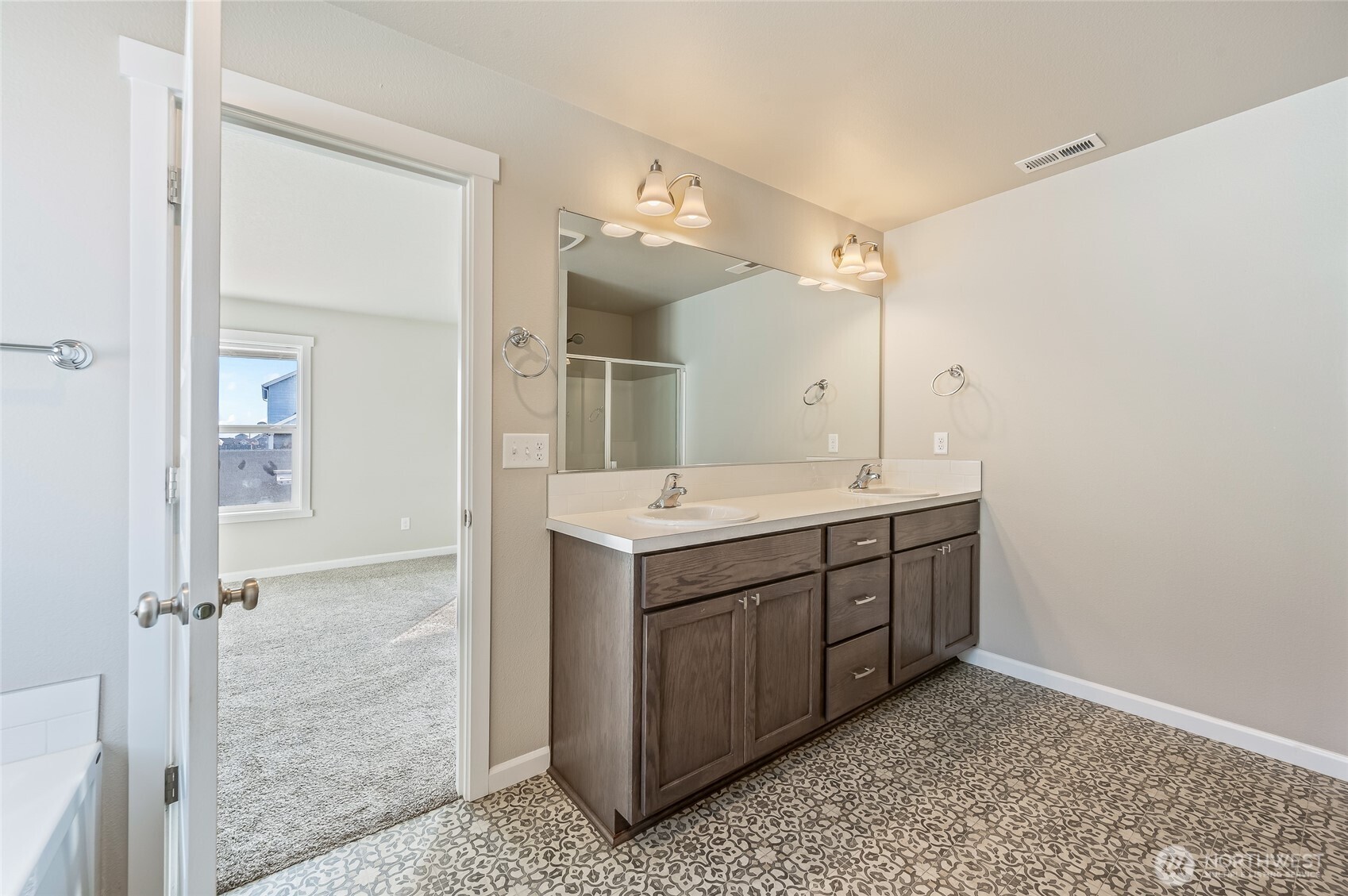 730 L Street Northeast Quincy, WA 98848 - Photo 12 of 29 a bathroom with a double vanity sink mirror and shower