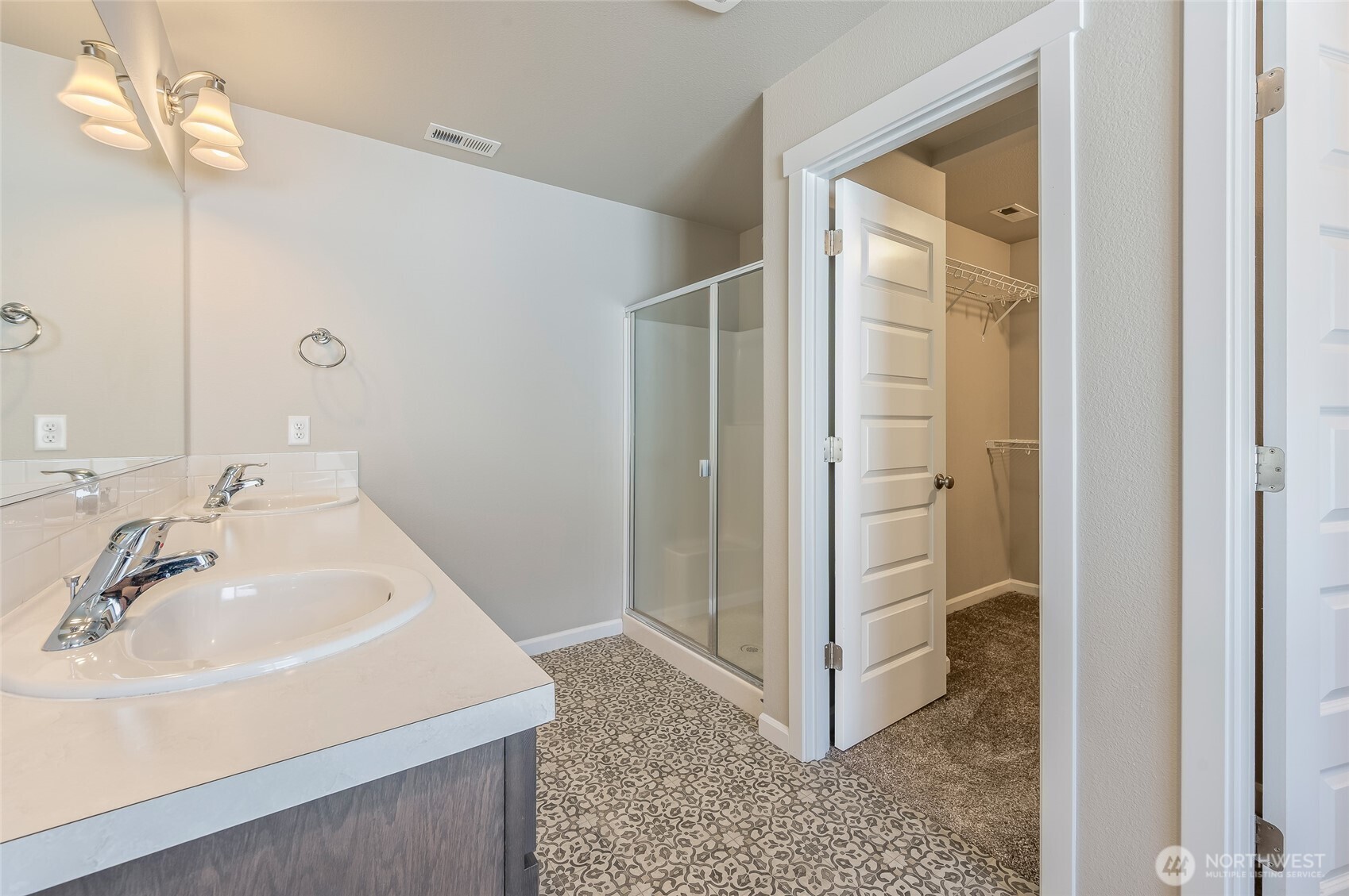 730 L Street Northeast Quincy, WA 98848 - Photo 13 of 29 a bathroom with a sink a mirror and a shower