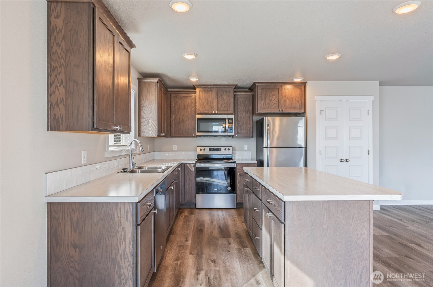 730 L Street Northeast Quincy, WA 98848 - Photo 3 of 29 a kitchen with stainless steel appliances granite countertop a sink stove and refrigerator