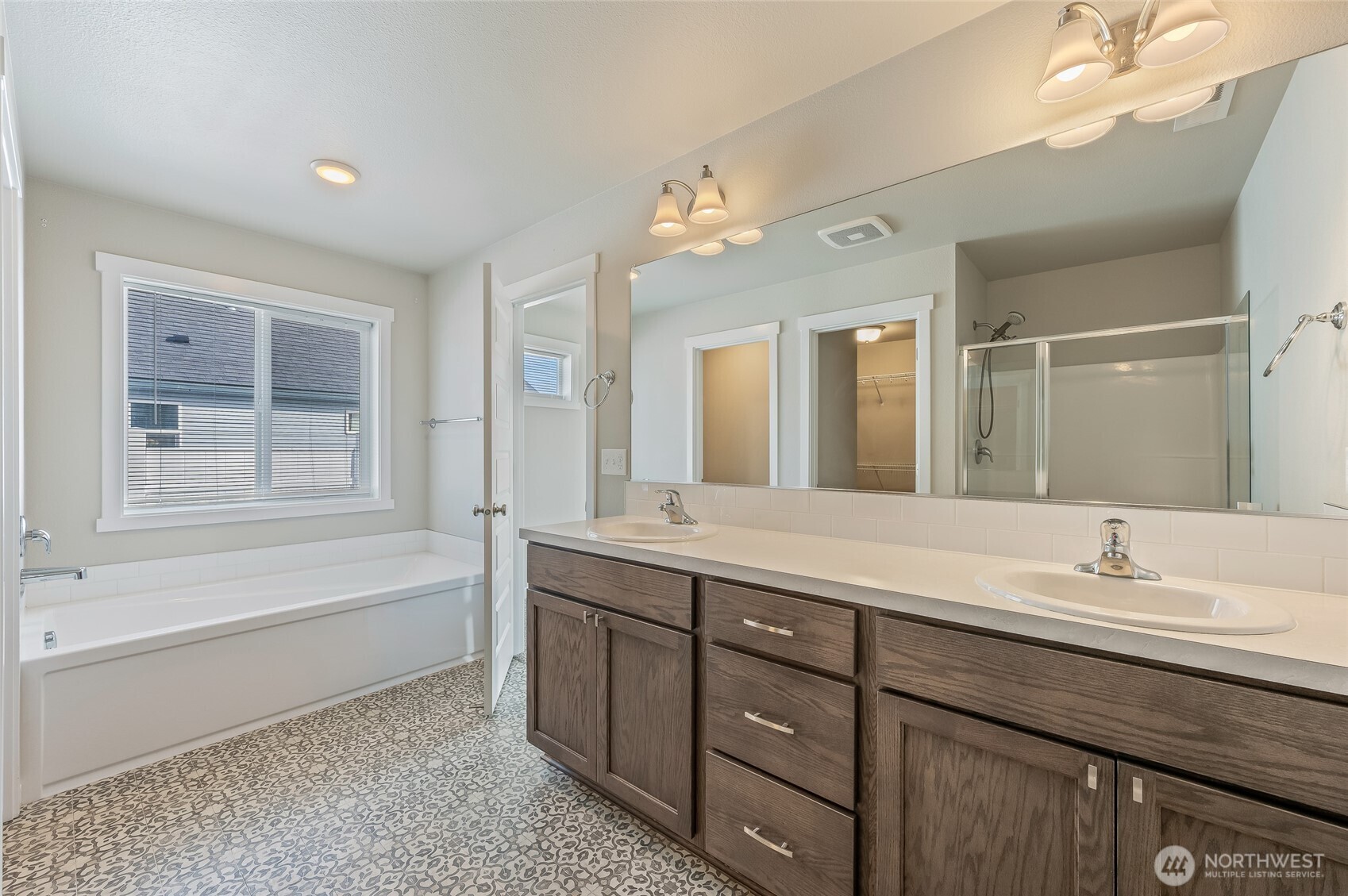730 L Street Northeast Quincy, WA 98848 - Photo 10 of 29 a bathroom with a tub sink double vanity and mirror