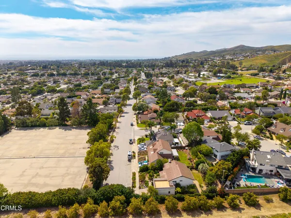 an aerial view of residential houses with outdoor space